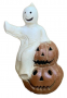 Joyful Ghost Sitting on Top of Two Pumpkins