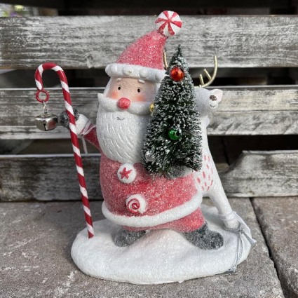 Santa holding a Tree and Candy Cane next to a Deer