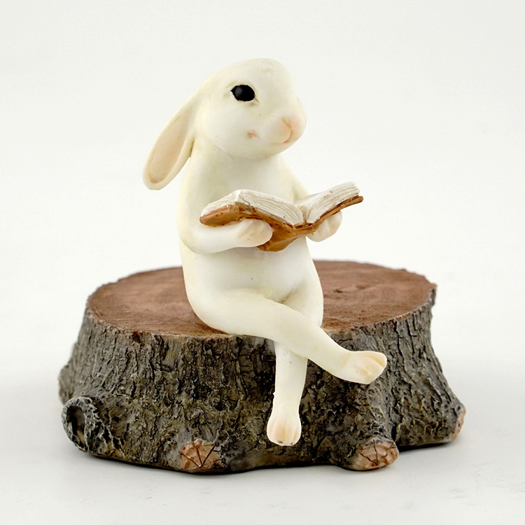 BUNNY READING ON STUMP